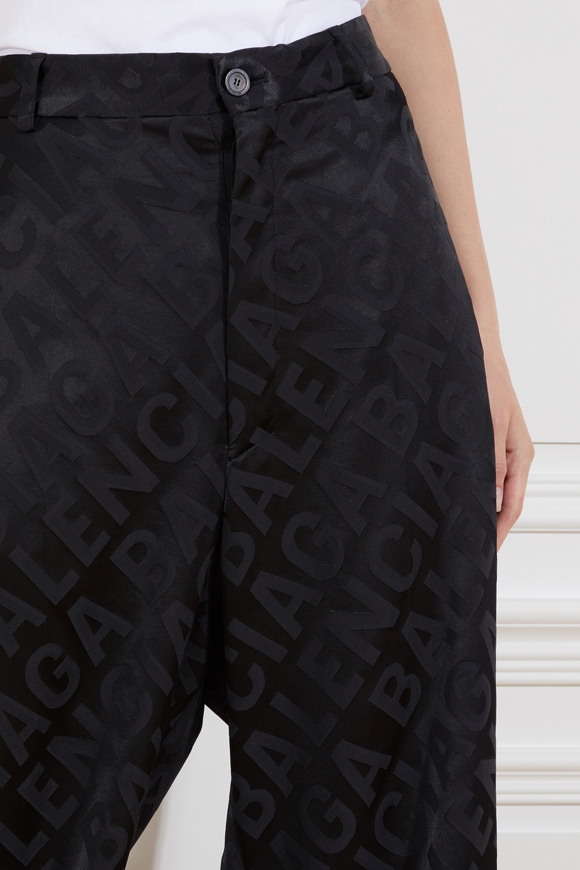 фото Черные брюки оверсайз с логотипами balenciaga