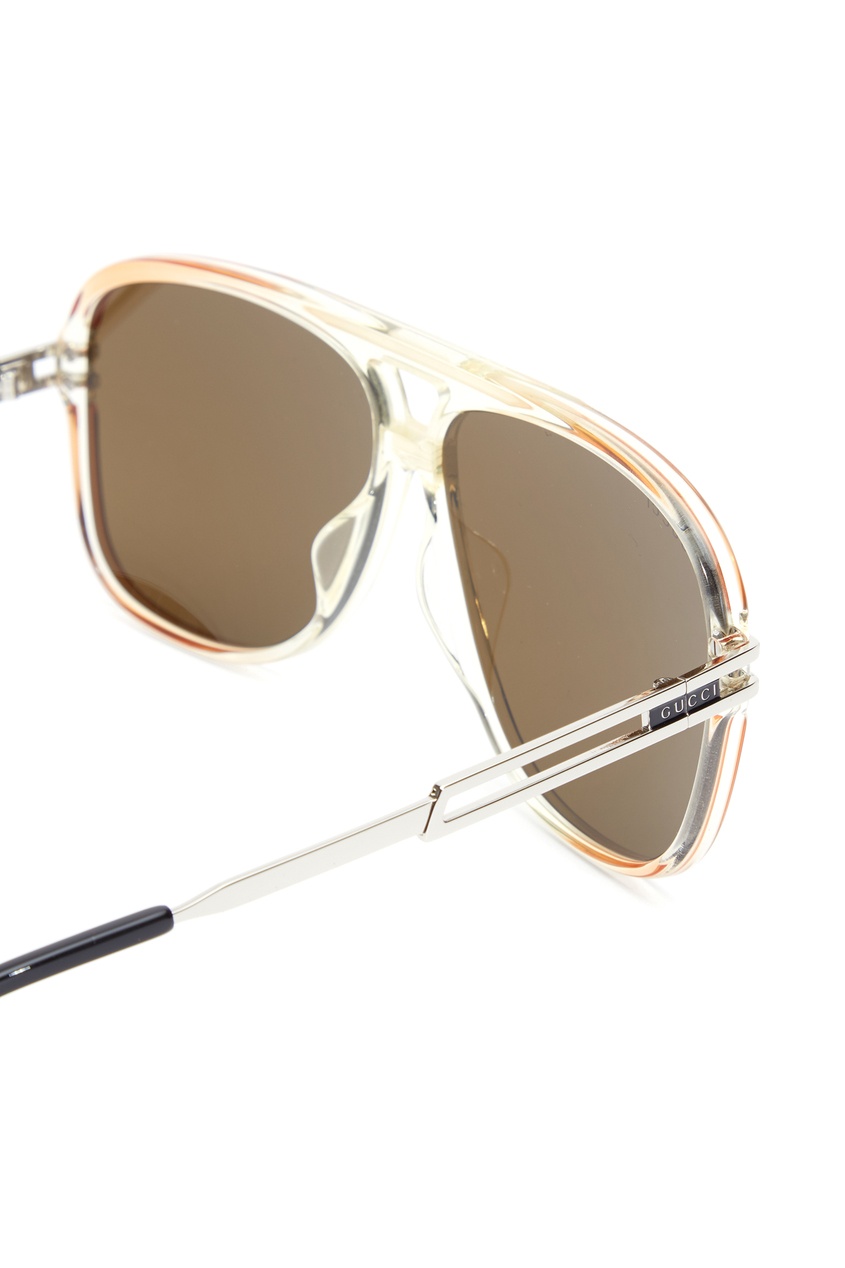 фото Коричневые солнцезащитные очки в оправе навигатор gucci