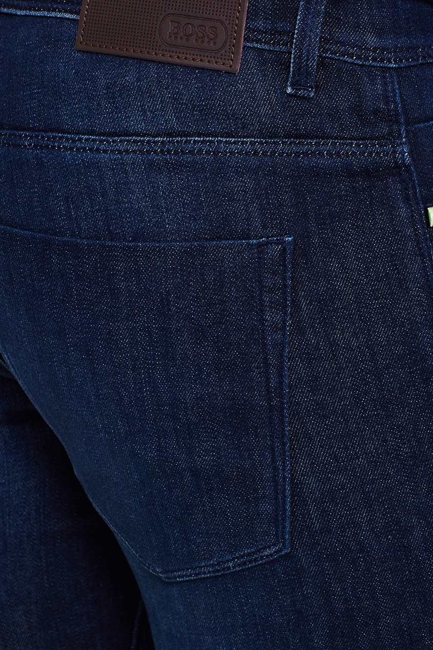 Темно-синие джинсы с потертостями