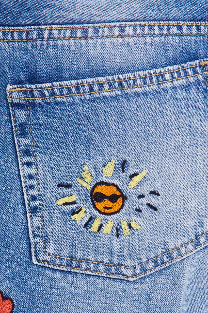 Голубые джинсы с вышивками