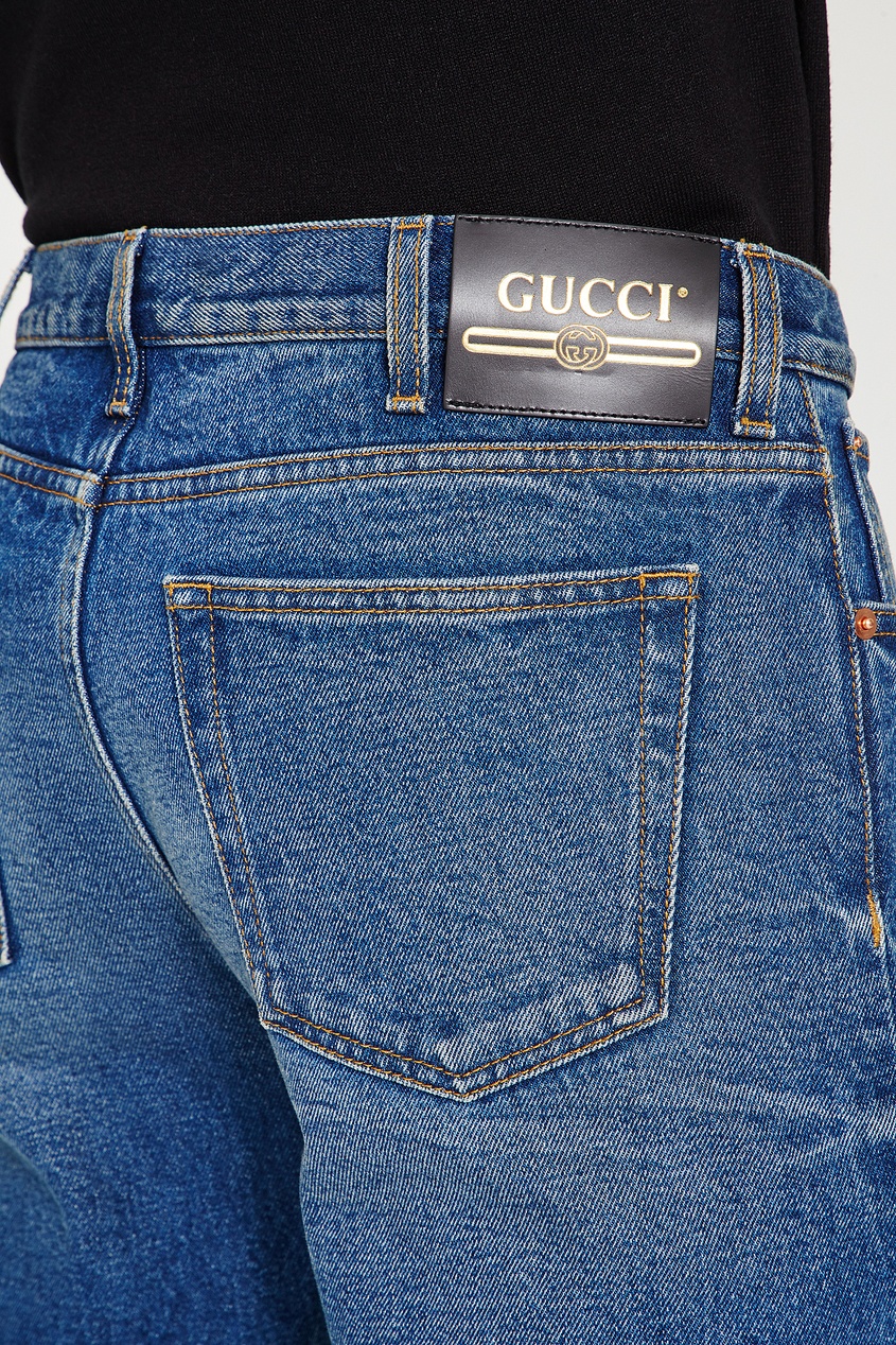 фото Синие джинсы с потертостями gucci
