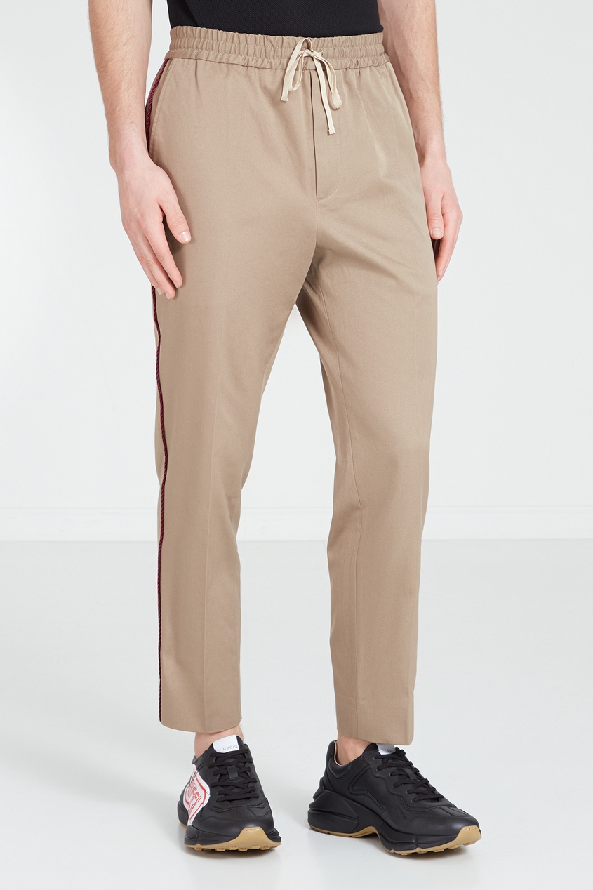 фото Бежевые брюки с контрастной тесьмой gucci