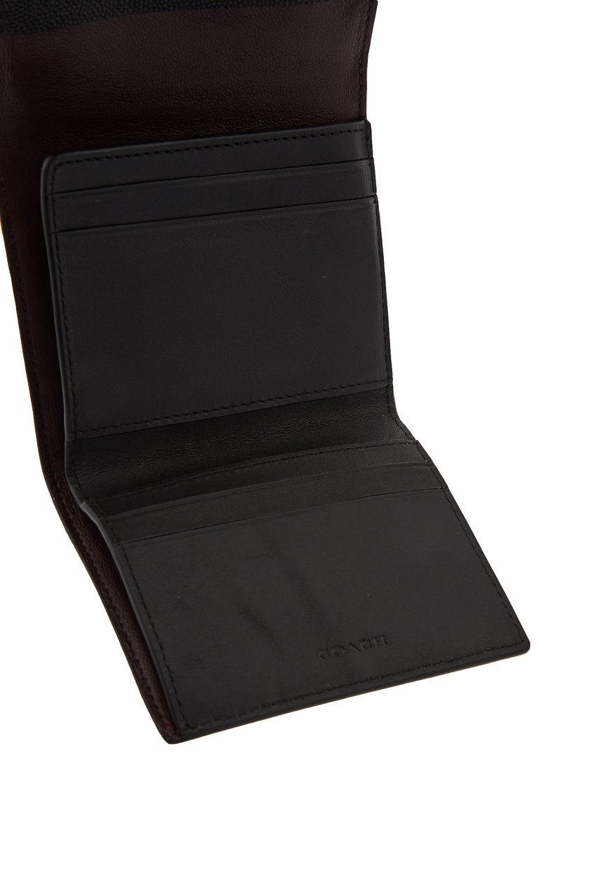 фото Компактный черный кошелек с монограммой Coach