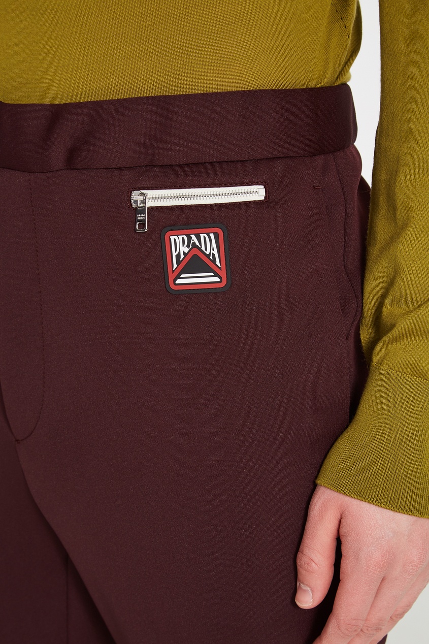 фото Бордовые трикотажные брюки с логотипом prada