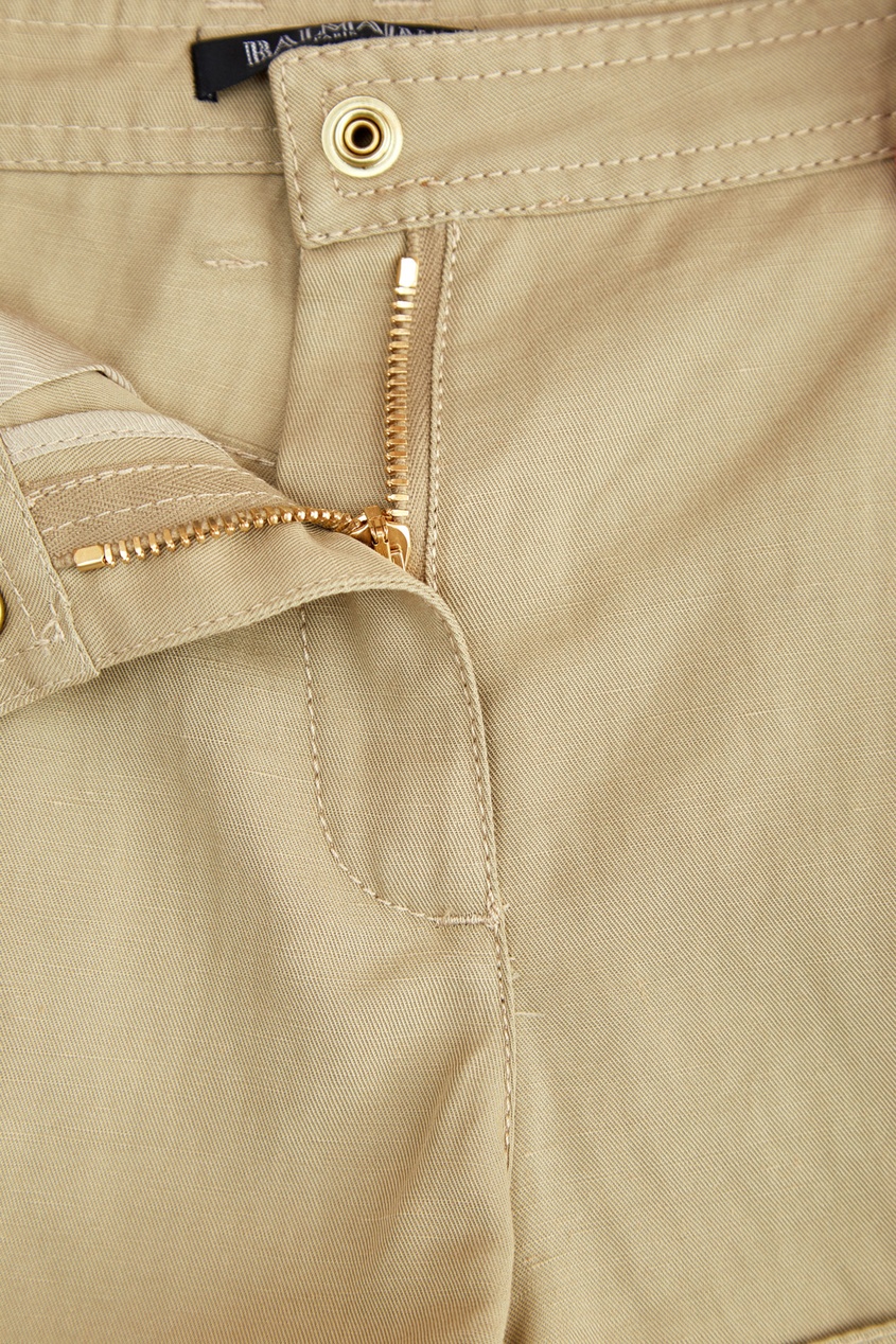 фото Короткие бежевые шорты с пуговицами balmain