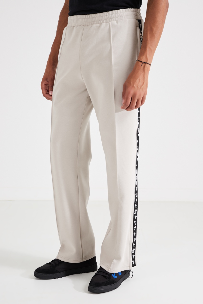 фото Светло-бежевые брюки из трикотажа off-white