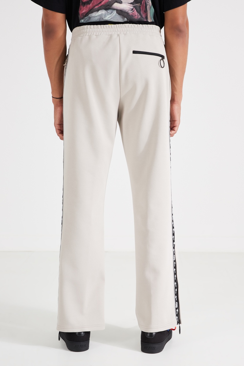 фото Светло-бежевые брюки из трикотажа off-white